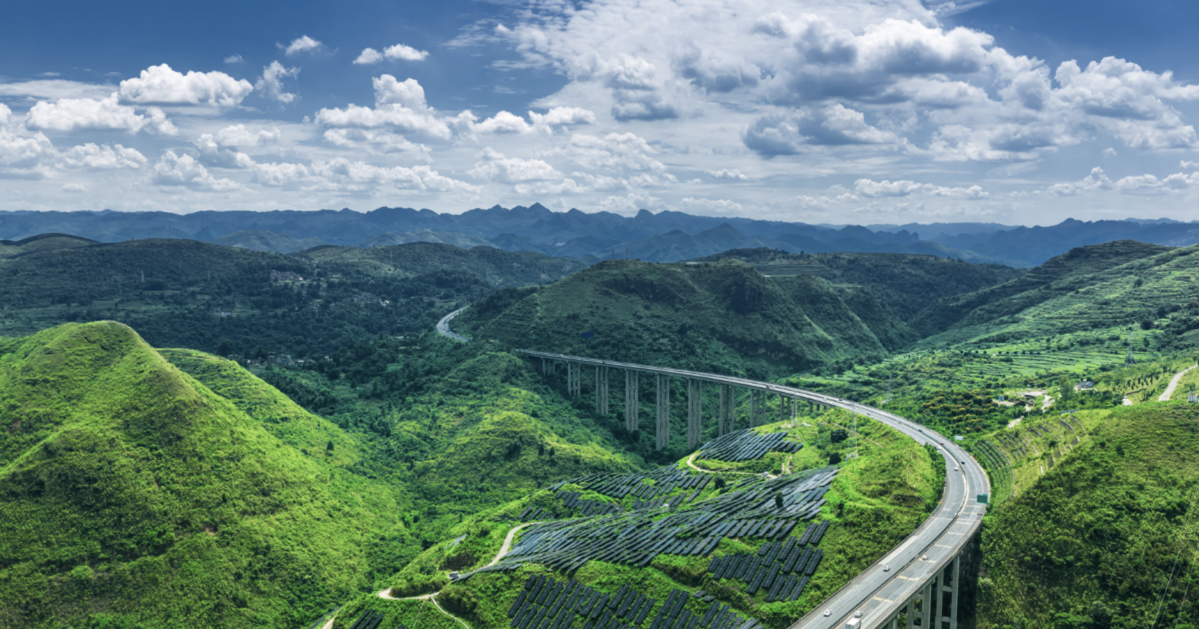 solar panels in the mountain forests with a highway